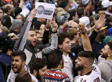 Demonstrators cheer after Republican U.S. presidential candidate Donald Trump cancelled his rally at the University of Illinois at Chicago March 11, 2016. REUTERS/Kamil Krzaczynski