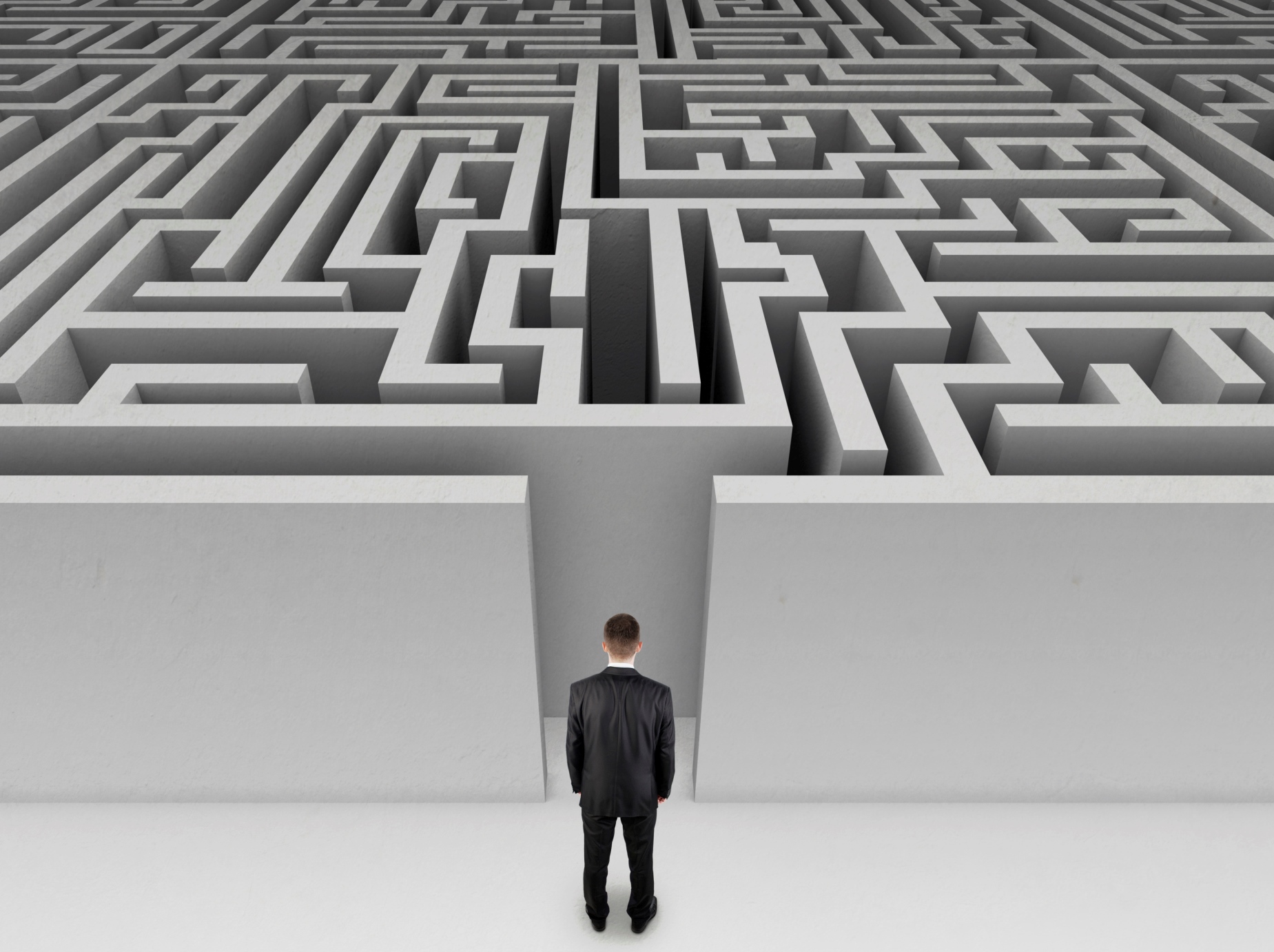 Businessman in front of a huge maze
