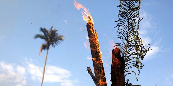 An tract of Amazon jungle burning as it is being cleared by loggers and farmers in Iranduba