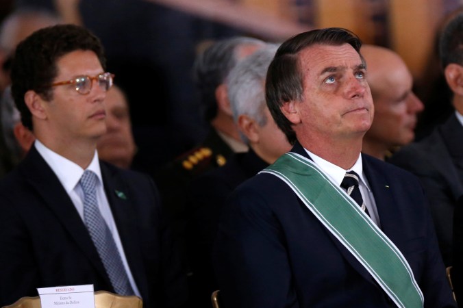 Brazil's President Jair Bolsonaro, Environment Minister Ricardo Salles and Vice President Hamilton Mourao attend a swearing-in ceremony for the country's new army commander in Brasilia