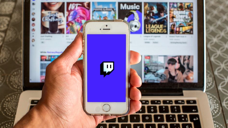In this photo illustration the Twitch app seen displayed on